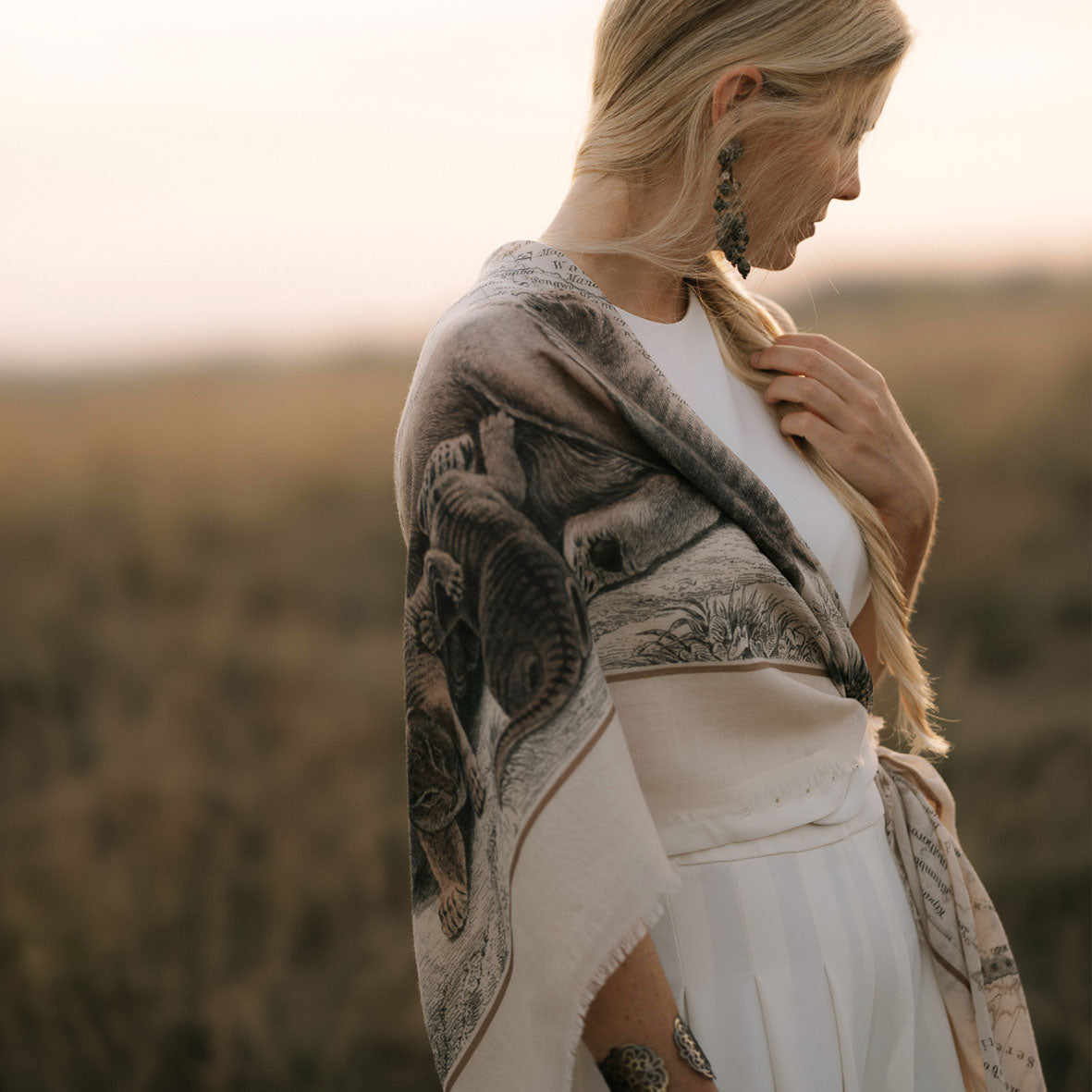 Maouli shawl wool and silk Neema around girl shoulder outdoor sunset