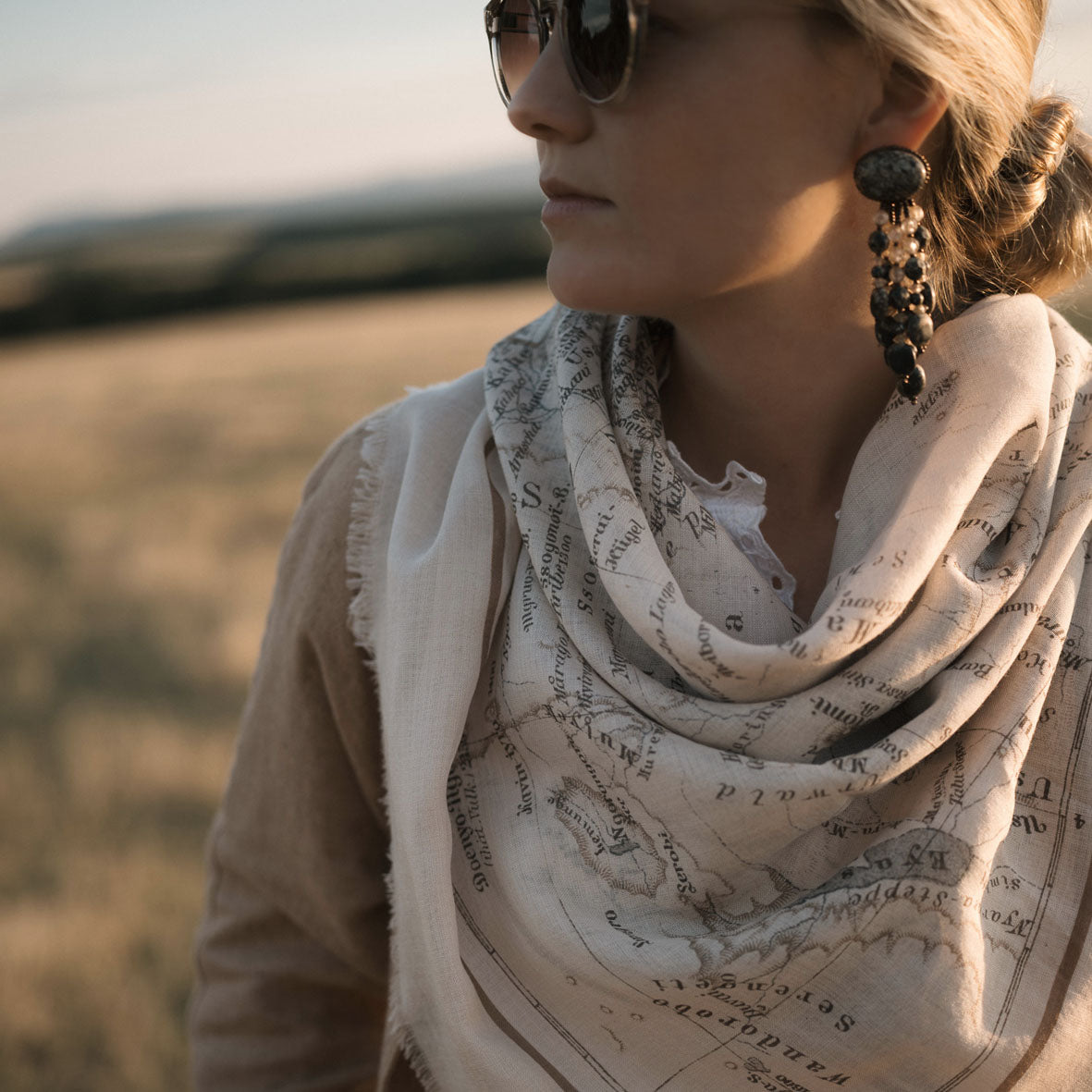 Maouli shawl wool and silk Neema around neck girl in fields